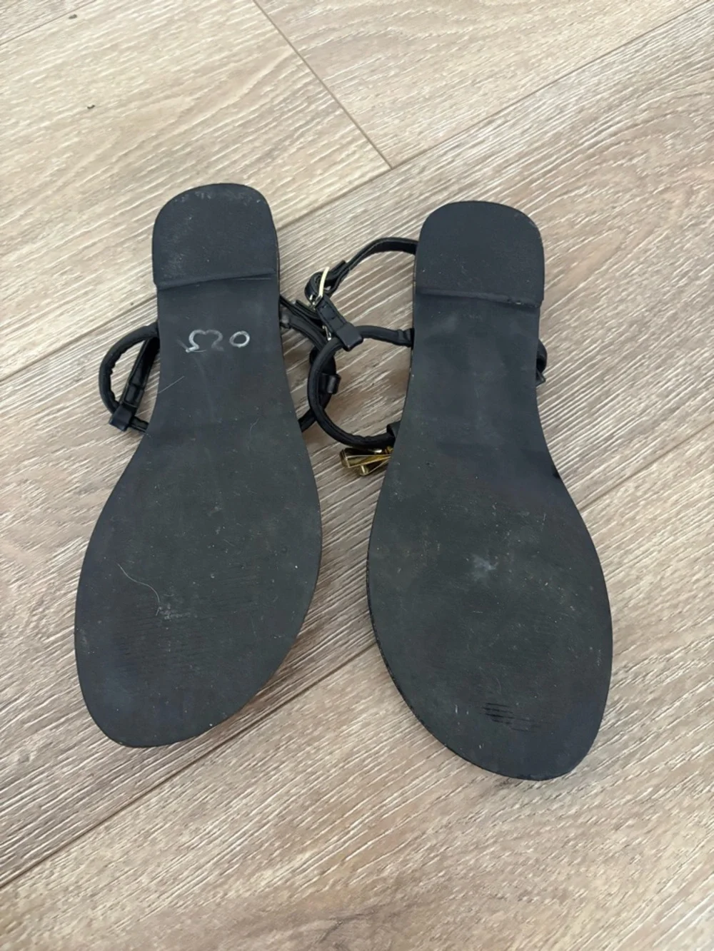 Steve Madden Black T-Strap Sandals with Gold Bow Accent